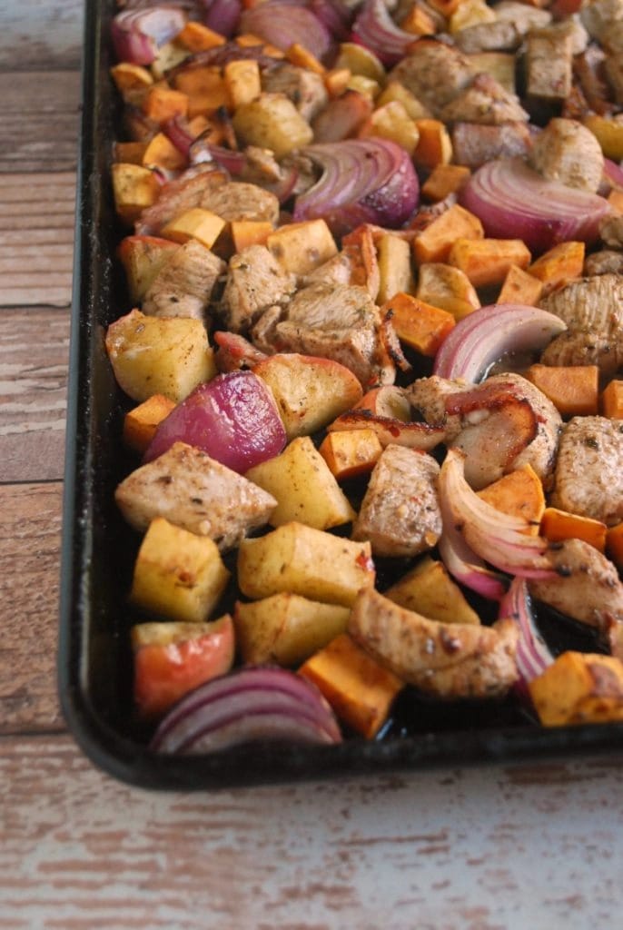 jamaican-jerk-chicken-bake Jamaican jerk chicken cooked in a sheet pan with potato, apple, and bacon.