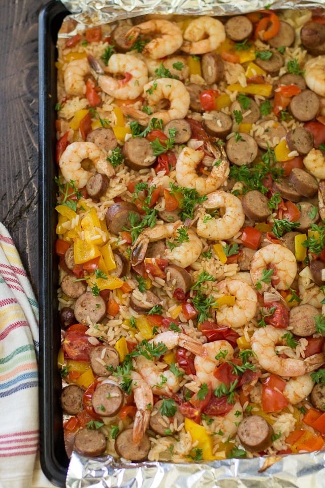 jambalaya Jambalay with onion, bell peppers, and sausage served on a sheet pan.