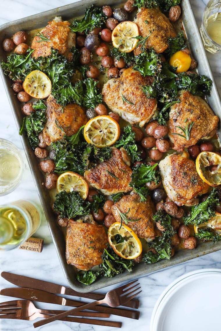 sheet-pan-lemon-rosemary-chicken Chicken cooked with lemon, rosemary and baby potatoes in a sheet pan.